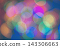 Abstract rainbow background with bokeh effect on a dark background. Christmas background with multicolored blurred lights. 143306663