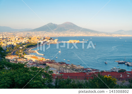 Panoramic view of Naples Italy coastline and bay featuring Mount Vesuvius and city architecture Panoramic view of Naples Italy coastline and bay featuring Mount Vesuvius and city architecture 143308802