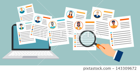 Employer hand holding magnifying glass and reviewing candidates resumes on a laptop Employer hand holding magnifying glass and reviewing candidates resumes on a laptop 143309672