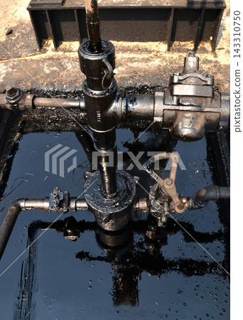 Oil Pipeline Valves and Industrial Petroleum Equipment Close-Up 143310750