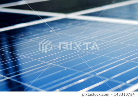 Solar Panel Close-Up with Blue Photovoltaic Cells 143310784