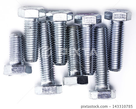 Metal Bolts and Threaded Steel Fasteners on White Background Metal Bolts and Threaded Steel Fasteners on White Background 143310785