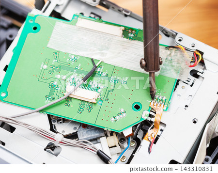 Circuit Board Repair with Soldering Iron on Electronic Device Circuit Board Repair with Soldering Iron on Electronic Device 143310831