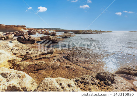 Scenic Rocky Coastline and Blue Mediterranean Sea in Cyprus 143310980