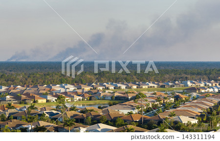 Air pollution with toxic smoke from prescribed forest fire close to rural neighborhood in Florida, USA Air pollution with toxic smoke from prescribed forest fire close to rural neighborhood in Florida, USA 143311194
