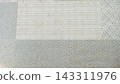 Minimalist background of a modern gray and off-white carpet tile texture featuring a clean geometric checkered and striped pattern. The structured fabric showcases a soft, woven material with subtle f 143311976
