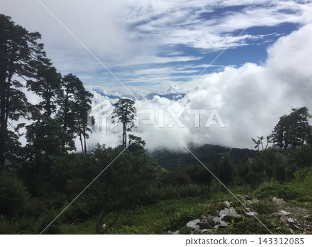 A breathtaking view of the sea of clouds and mountains from the Dochula Pass in Bhutan. A breathtaking view of the sea of clouds and mountains from the Dochula Pass in Bhutan. 143312085