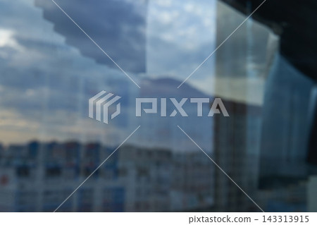 Window Reflections Overlay Blurred Apartment Buildings And Cloudy Sky, Creating Translucent Window Reflections Overlay Blurred Apartment Buildings And Cloudy Sky, Creating Translucent 143313915
