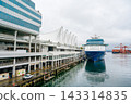A panoramic view of luxury ocean liner docked at Canada Place Marina in Vancouver, Canada. 143314835