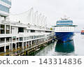 A panoramic view of luxury ocean liner docked at Canada Place Marina in Vancouver, Canada. 143314836