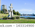 A giant Inuit stone landmark overlooking the Buller Bridge on the green lawn of English Bay, Vancouver, Canada. 143314900