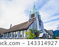 The historic Alpine wooden church in Whistler, British Columbia, Canada, with its spires and blue skies. 143314927