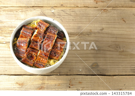 Photo of a single serving of unadon (eel rice bowl). Photo of a single serving of unadon (eel rice bowl). 143315784