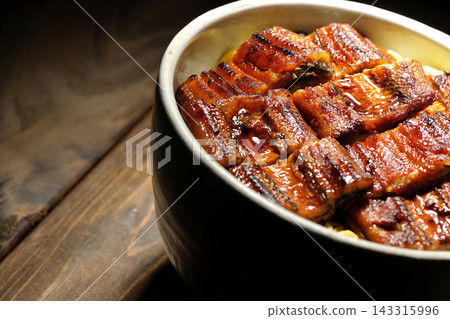 Photo of a single serving of unadon (eel rice bowl). Photo of a single serving of unadon (eel rice bowl). 143315996