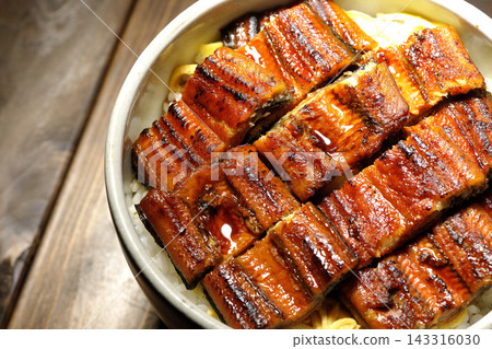 Photo of a single serving of unadon (eel rice bowl). Photo of a single serving of unadon (eel rice bowl). 143316030