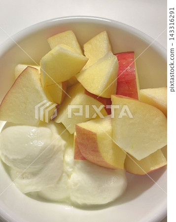 Freshly sliced apple pieces with crisp texture and natural sweetness, beautifully arranged. A healthy and refreshing snack perfect for any time of the day. Freshly sliced apple pieces with crisp texture and natural sweetness, beautifully arranged. A healthy and refreshing snack perfect for any time of the day. 143316291