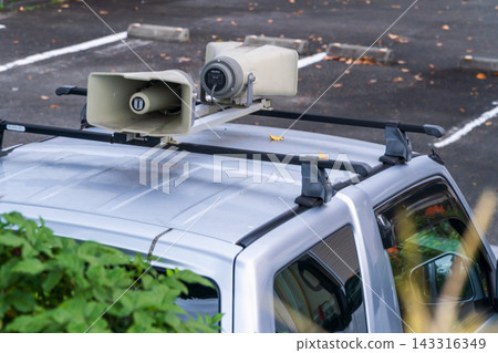 A press vehicle with speakers mounted on its roof. A press vehicle with speakers mounted on its roof. 143316349