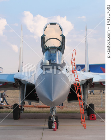 Russian Air Force Sukhoi Su-35S fighter jets parked on the tarmac. Russian Air Force Sukhoi Su-35S fighter jets parked on the tarmac. 143317003