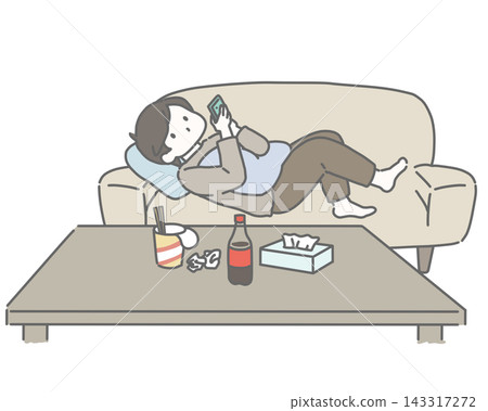 A man looks at his smartphone without cleaning up his junk food. A man looks at his smartphone without cleaning up his junk food. 143317272