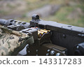 Close Up of Ammunition Belt Loaded Into Heavy Machine Gun 143317283
