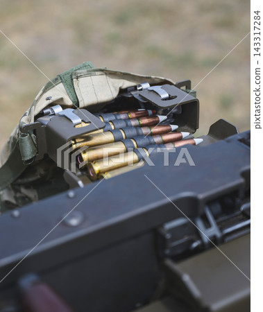 Close Up of Linked Ammunition Belt for Heavy Machine Gun Close Up of Linked Ammunition Belt for Heavy Machine Gun 143317284