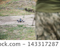 FPV Drone on Ground at Outdoor Military Training Area 143317287