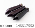 Three fresh long eggplants lined up against a white background. 143317552