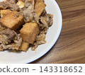 Chicken stew, served on a white plate, frozen chicken and vegetables. 143318652