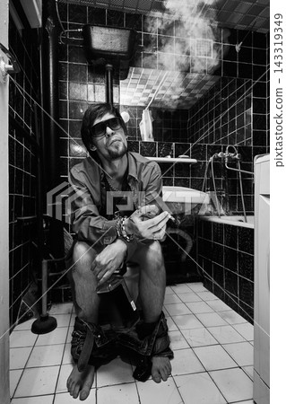 Drunk Smoker Surrounded by Cigarette Smoke on Toilet Drunk Smoker Surrounded by Cigarette Smoke on Toilet 143319349