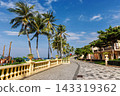 Phu Quoc, Vietnam - January 3 2026: Palm-lined tropical promenade near seaside restaurant in Phu Quoc 143319362