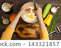Home cooking vegetable fritters preparation with fresh ingredients on wooden kitchen table 143321857