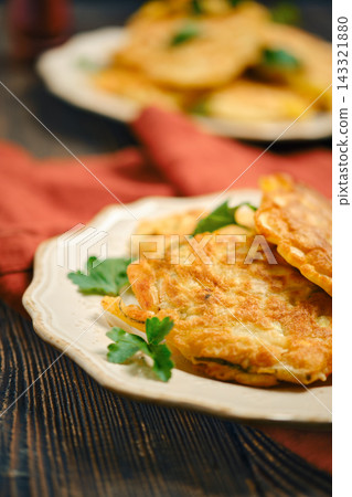 Home cooking vegetable fritters made in kitchen with fresh ingredients Home cooking vegetable fritters made in kitchen with fresh ingredients 143321880