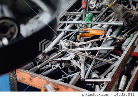 Assorted mechanic tools are ready for use in a full metal toolbox Assorted mechanic tools are ready for use in a full metal toolbox 143323011