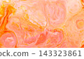 Peach and pink fluid art with liquid paint forming organic loops across an abstract background 143323861
