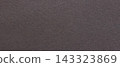 Dark brown paper texture with a blank matte surface and fine grain on a muted monochrome background 143323869