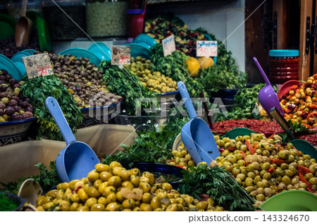 Assorted seasoned olives at a market stall in Fes souk Assorted seasoned olives at a market stall in Fes souk 143324670