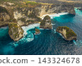 Aerial shot at sea with turquoise water and rocks. Atuh beach, Nusa Penida, Bali, Indonesia. 143324678
