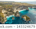 Aerial shot at sea with turquoise water and rocks. Atuh beach, Nusa Penida, Bali, Indonesia. 143324679