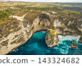 Aerial shot at sea with turquoise water and rocks. Atuh beach, Nusa Penida, Bali, Indonesia. 143324682