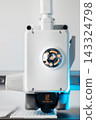 Close up of 3D printer nozzle with caution hot warning sign 143324798