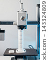 3D printer head printing a detailed white plastic component 143324809