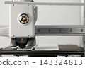Modern additive manufacturing printhead during calibration proces 143324813