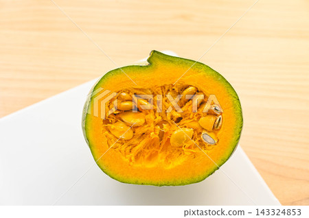 Cut white pumpkin and bright yellow flesh Cut white pumpkin and bright yellow flesh 143324853