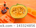 Halloween decorations and a cross-section of a white-skinned pumpkin (Shiro Mikuri) 143324856