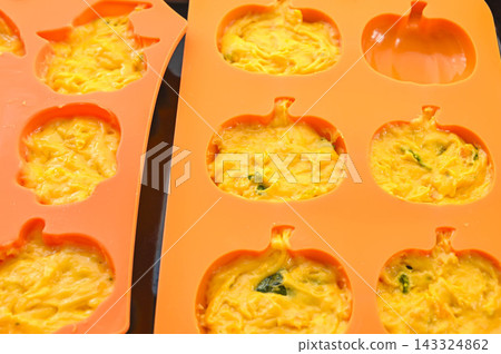 Pumpkin cake made by pouring batter into a silicone mold. Pumpkin cake made by pouring batter into a silicone mold. 143324862