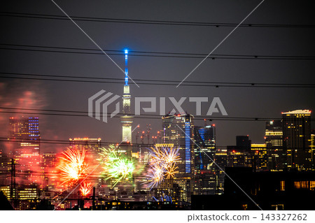 Kawasaki Cityscape, Japan: Tamagawa Fireworks Festival 2026. The venue side of the Kawasaki City Anniversary Tamagawa Fireworks Festival. Roppongi Hills and other landmarks are visible in the background… Kawasaki Cityscape, Japan: Tamagawa Fireworks Festival 2026. The venue side of the Kawasaki City Anniversary Tamagawa Fireworks Festival. Roppongi Hills and other landmarks are visible in the background… 143327262