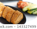 Grilled rice ball and assorted pickles 143327499