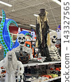 Scary ghost decorations for Halloween displayed inside the store 143327565