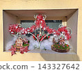 Feast Day Window With Tinsel Gingerbread Houses And Moss Feast Day Window With Tinsel Gingerbread Houses And Moss 143327642