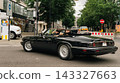 Black classic convertible driving on Kurfurstendamm at Classic Days Berlin 143327663